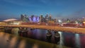 Aerial view over Helix Bridge and Bayfront Avenue with traffic day to night timelapse at Marina Bay, Singapore Royalty Free Stock Photo