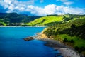 Aerial view over Hokianga Harbour surrounded by lush green hills and cozy beached. Iconic New Zealand, Northland