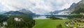 Aerial view over Lake Sils with morning fog and clouds and the Chaste island