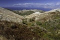 Aerial view over mountains to the rural road