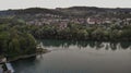 Aerial view over Aare river, to the church and residential area of Umiken and Riniken, Switzerland