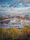 Aerial view over the Paris city to the Sacre Coeur de Montmartre basilica on the hill, France. Autumn parisian cityscape, vertical Royalty Free Stock Photo