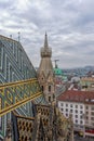 Aerial view over the rooftops of Vienna city from the north tower of St. Stephen`s Cathedral with the cathedral`s famous ornatel Royalty Free Stock Photo