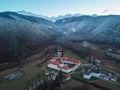 Aerial view over Sambata de Sus orthodox Monastery in winter