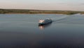 Aerial view overflying a river cruise ship.