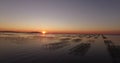 Aerial view of an oyster field during sunset