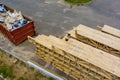 Packs of lumber at the natural materials from wood with roof rafters for building a house