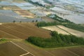 Aerial view of paddy,rice,fields,coconut plams and harvested water bodies,reservoirs from district Kakinada also known as rice Royalty Free Stock Photo