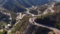 Aerial view of Pakistani Trucks on a Highway Road Winding through a Mountains, in Punjab, Khyber Pakhtunkhwa, Pakistan.