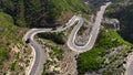 Aerial view of Pakistani trucks on a highway road winding through a mountains, in Punjab, Khyber Pakhtunkhwa, Pakistan.