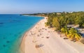 Aerial view of palms on the sandy beach of Indian Ocean at sunset Royalty Free Stock Photo