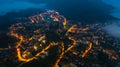 Aerial view of panorama landscape at the hill town in Sapa city, Vietnam at night and sunset, mountain view in the clouds