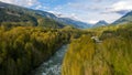 Aerial view of the panorama at the point where the Slesse creek flows into the Chilliwack river with the Welch Peak in the