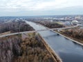 Aerial view panorama of railway bridge over river and high-speed road highway. the picture from the drone Royalty Free Stock Photo