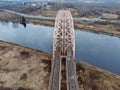 Aerial view panorama of railway bridge over river and high-speed road highway. the picture from the drone Royalty Free Stock Photo