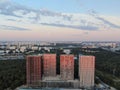 Aerial view panoramic landscape of Moscow city at sunrise. Modern houses in the rays of the golden sun. Drone shot