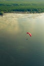 Aerial view of paraglider flying over a blue sea Royalty Free Stock Photo