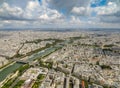 Aerial view of Paris cityscape including the River Seine under a cloudy blue sky Royalty Free Stock Photo