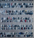 Aerial view of a parking lot full of rows and rows or cars Royalty Free Stock Photo