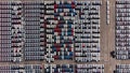 Aerial view of a parking lot new cars lined up in the port for i