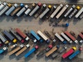 Aerial view of a parking lot of trucks ready for loading containers and delivery Royalty Free Stock Photo