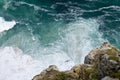 An aerial view of the pattern formed by the waves breaking against the coast at Cape Point in South Africa Royalty Free Stock Photo