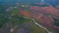 aerial view on the peak in sunset the village far from civilization Traveling on a difficult road.