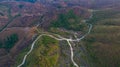 aerial view on the peak in sunset the village far from civilization Traveling on a difficult road.