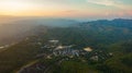 aerial view on the peak in sunset the village far from civilization Traveling on a difficult road.