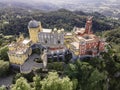 Aerial view of Pena Palace, a colourful Romanticist castle building on hilltop during a beautiful sunset, Sintra, Lisbon, Portugal Royalty Free Stock Photo