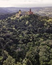 Aerial view of Pena Palace, a colourful Romanticist castle building on hilltop during a beautiful sunset, Sintra, Lisbon, Portugal Royalty Free Stock Photo