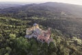Aerial view of Pena Palace, a colourful Romanticist castle building on hilltop during a beautiful sunset, Sintra, Lisbon, Portugal Royalty Free Stock Photo