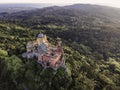 Aerial view of Pena Palace, a colourful Romanticist castle building on hilltop during a beautiful sunset, Sintra, Lisbon, Portugal Royalty Free Stock Photo