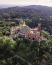 Aerial view of Pena Palace, a hilltop Romanticist palace in parkland at sunset, Sintra, Lisbon, Portugal Royalty Free Stock Photo