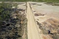 Aerial View Of People Controlling Drone Over Road Through Salt Flats Royalty Free Stock Photo