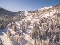 People Skiing In A Beautiful Snowy Ski Resort At Winter