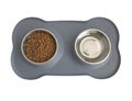 Aerial view of pet food dish made of stainless steel and non-slip silicone base. Dry pet - dog food in metal bowl with feed and Royalty Free Stock Photo