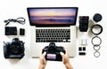 Aerial view of photographer hands using camera