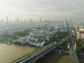 Aerial view of Phra Buddha Yodfa Bridge, Memorial Bridge and Phra Pok Klao Bridge over the Chaophraya River at sunrise