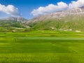 Aerial view of Piano Grande, large karstic plateau of Monti Sibillini mountains. Beautiful fields of the Monti Sibillini National Royalty Free Stock Photo