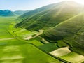 Aerial view of Piano Grande, large karstic plateau of Monti Sibillini mountains. Beautiful fields of the Monti Sibillini National Royalty Free Stock Photo