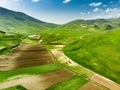 Aerial view of Piano Grande, large karstic plateau of Monti Sibillini mountains. Beautiful fields of the Monti Sibillini National Royalty Free Stock Photo