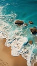 Aerial view of a picturesque beach, turquoise waters, and beachside loungers