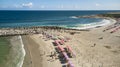 Aerial view picturesque public beach with turquoise water. Los Corales, La Guaira, Venezuela Royalty Free Stock Photo