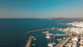 Aerial view of the pier with Paros island on a background Naousa village