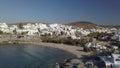 Aerial view of the pier with Paros island on a background Naousa village