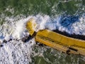 Aerial view of a pier with rocks. Pizzo Calabro pier, panoramic view from above. Broken pier, force of the sea. Power of Waves. N