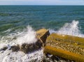 Aerial view of a pier with rocks. Pizzo Calabro pier, panoramic view from above. Broken pier, force of the sea. Power of Waves. N