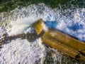 Aerial view of a pier with rocks. Pizzo Calabro pier, panoramic view from above. Broken pier, force of the sea. Power of Waves. N