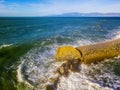 Aerial view of a pier with rocks. Pizzo Calabro pier, panoramic view from above. Broken pier, force of the sea. Power of Waves. N